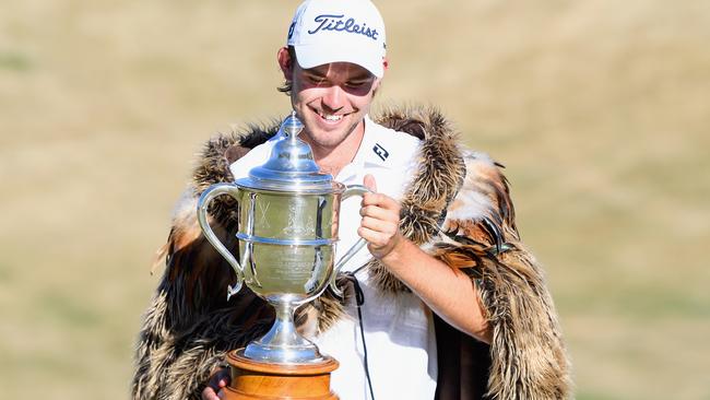 Zach Murray with the trophy and fur coat he won at the New Zealand Open. Picture: Getty Images