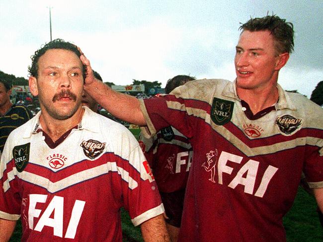 Steve Menzies (C) congratulates teammate Cliff Lyons (L) after his last game for Manly at Brookvale, following NRL game against North Queensland Cowboys, 16/08/98.Rugby League