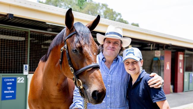 Tom Magnier with son Charlie, 14, and lot 676 at the Magic Millions sales. Picture: Luke Marsden.