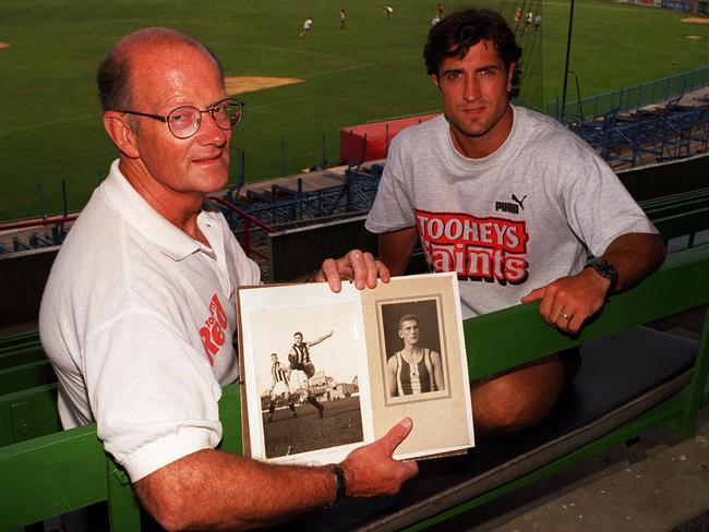 Feb96- John Beveridge former footballer pictured with his son Luke holds a some old photos of his father Jack who played for Collingwood in the 30's. Luke will play for St.Kilda like his father./afl/aussie rules football