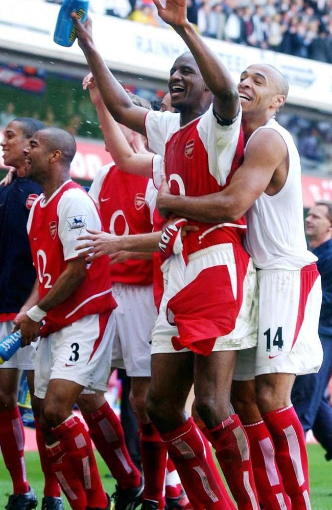 Thierry Henry embracing Patrick Vieira after winning the league in 2004.