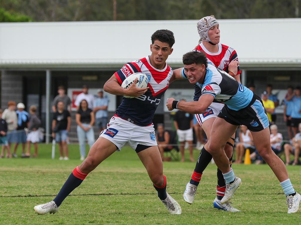 Jeziah Papa brushing off Spencer Swan. Picture: Adam Wrightson Photography