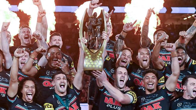 TOPSHOT - Panthers players celebrate with the trophy after winning the 2023 NRL Grand Final match between Penrith Panthers and Brisbane Broncos at Accor Stadium in Sydney on October 1, 2023. (Photo by Izhar KHAN / AFP) / -- IMAGE RESTRICTED TO EDITORIAL USE - STRICTLY NO COMMERCIAL USE --