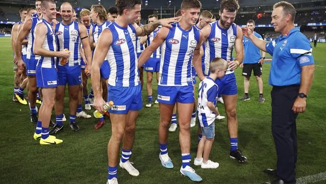 Simpkin, Harry Sheezel, Luke McDonald and Kangaroos coach Alastair Clarkson celebrate after winning the round one. Picture: Daniel Pockett/Getty Images