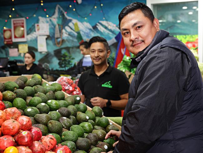 Prayash King and owner Bibek Pradhan at the Strathfield Veggie Shed. Picture: Adam Yip