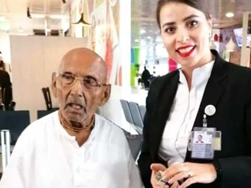 Mr Sivananda with a worker at Abu Dhabi airport.