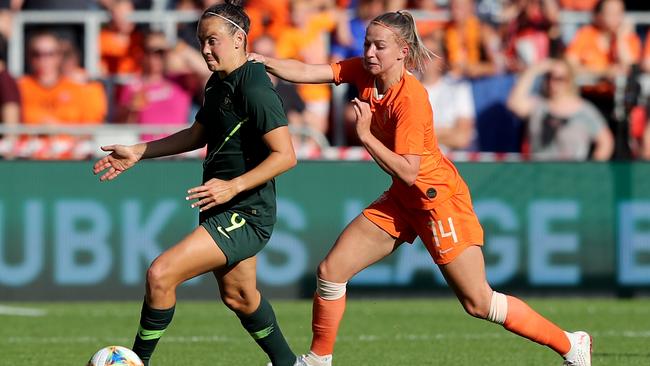 Caitlin Foord of Australia, left, is challenged by Jackie Groenen of Netherlands during a friendly last week. Picture: Getty Images