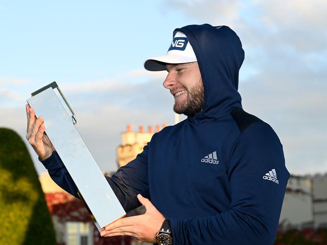 Tyrrell Hatton wearing his hoodie with the winners trophy after the final round of the BMW PGA Championship