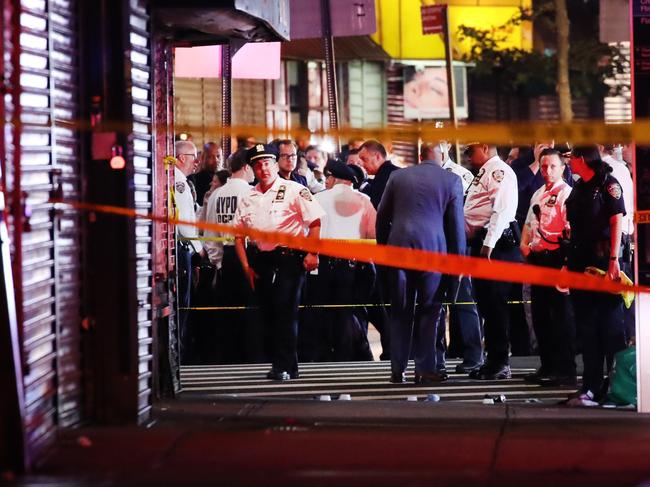 Police gather at the scene where the police officers were shot and stabbed in NYC. Picture: Getty Images/AFP