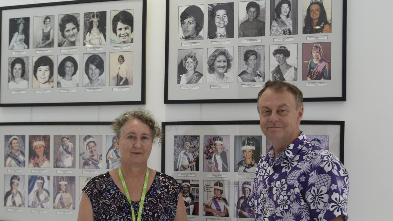 ROYALTY: Grafton head librarian Katrina Shillam and jacaranda festival president Jeff Smith admire the Jacaranda queens of the past.