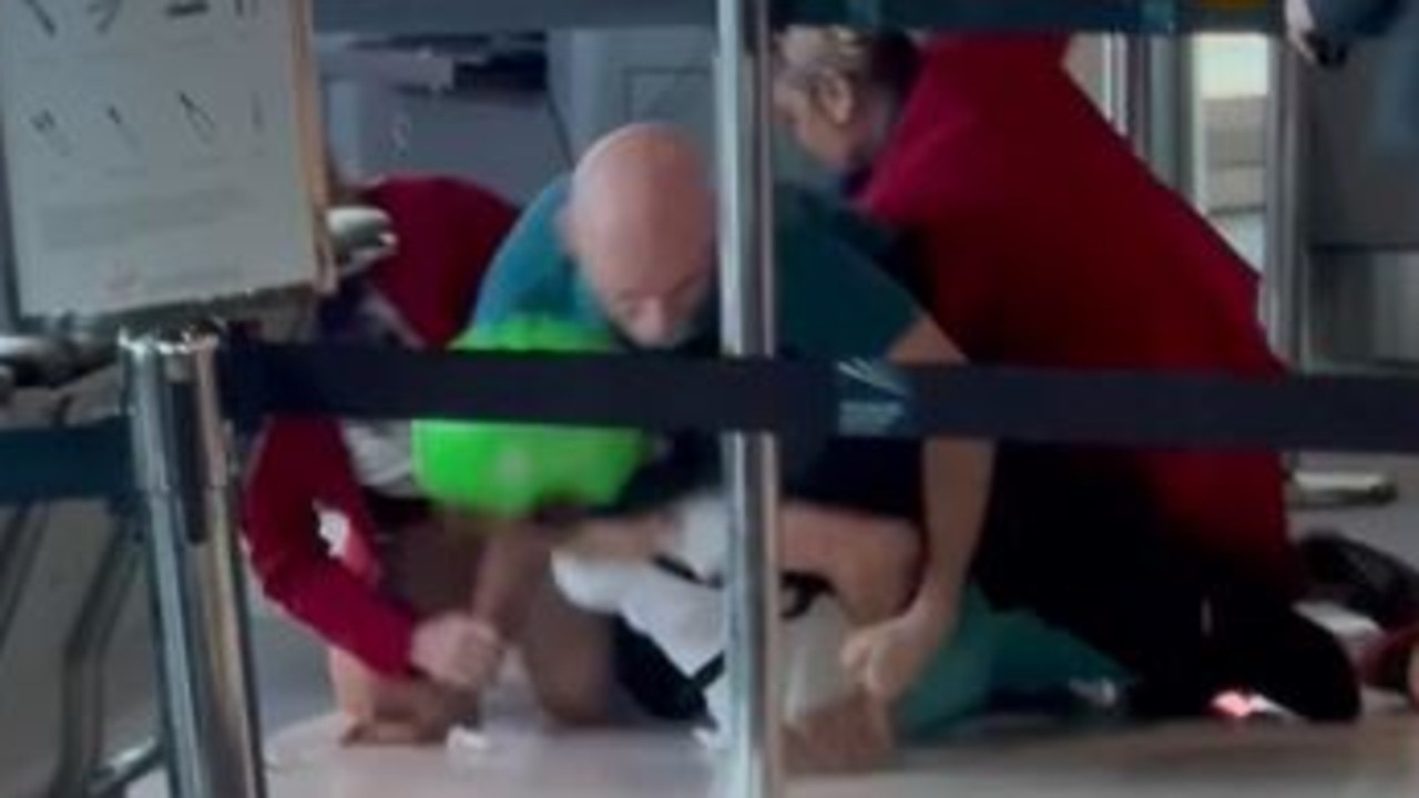 Man wrestled to ground in Brisbane Airport drama
