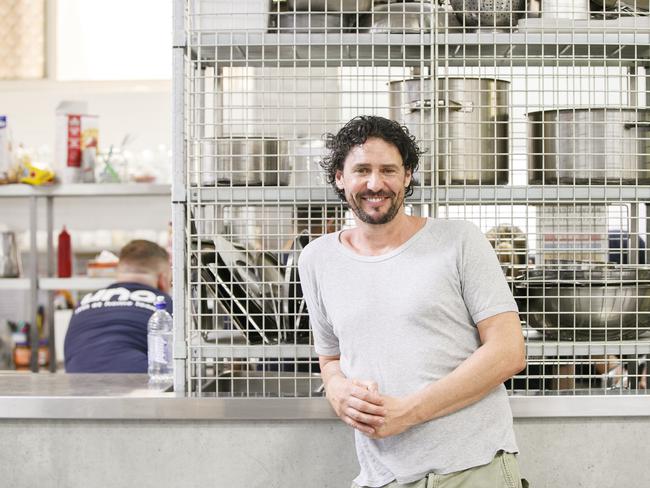 Colin Fassnidge helping out in the kitchen at the Salvation army in Surry Hills. Photo: Tim Pascoe