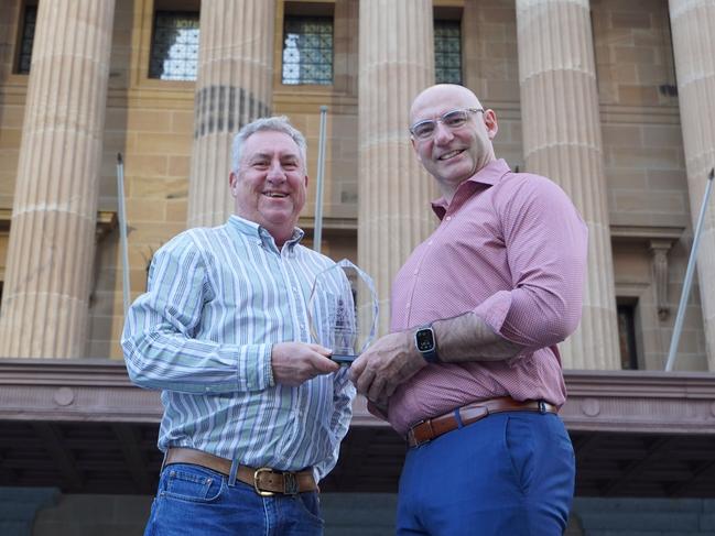 Wujal Wujal Director of Nursing Vince Connellan with Torres and Cape Hospital and Health Service Chief Executive Rex OâRourke in Brisbane for the awards.