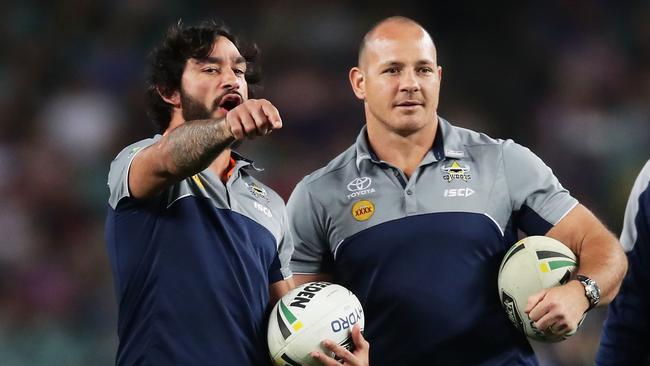 Johnathan Thurston and Matt Scott assist the Cowboys’ warm-up.