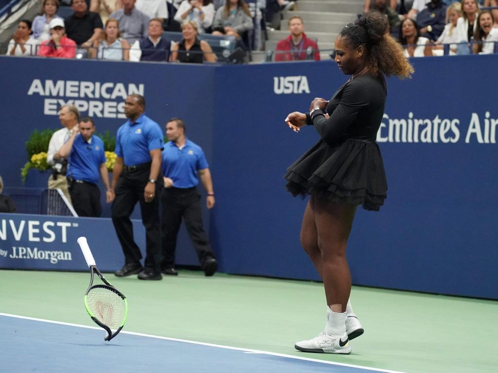 Serena Williams’s racket bends from the force of the throw. Picture: Timothy Clary/AFP