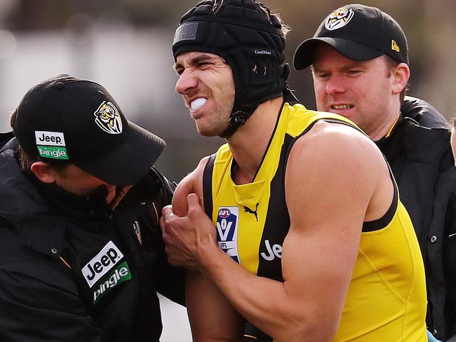 VFL.  Richmond v Colingwood at Punt road Oval. Richmond's Ben Griffiths in the hands of medicos after he injured his shoulder in the 2nd qtr . Pic: Michael Klein