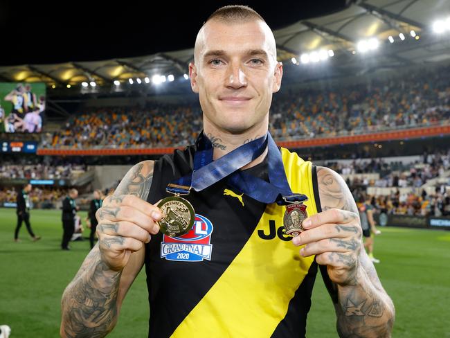 BRISBANE, AUSTRALIA – OCTOBER 24: Dustin Martin of the Tigers celebrates with his Norm Smith Medal and Premiership Medal during the 2020 Toyota AFL Grand Final match between the Richmond Tigers and the Geelong Cats at The Gabba on October 24, 2020 in Brisbane, Australia. (Photo by Michael Willson/AFL Photos via Getty Images)