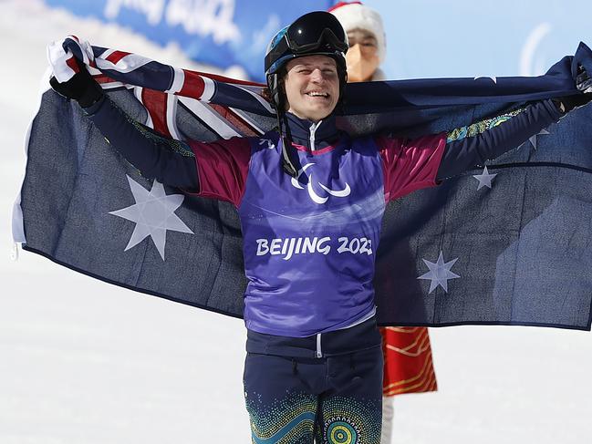 ZHANGJIAKOU, CHINA - MARCH 07: Bronze medallist Ben Tudhope of Team Australia celebrates after competing in the Men's Snowboard Cross SB-LL2 Big Final at Genting Snow Park during day three of the Beijing 2022 Winter Paralympics on March 07, 2022 in Zhangjiakou, China. (Photo by Steph Chambers/Getty Images)