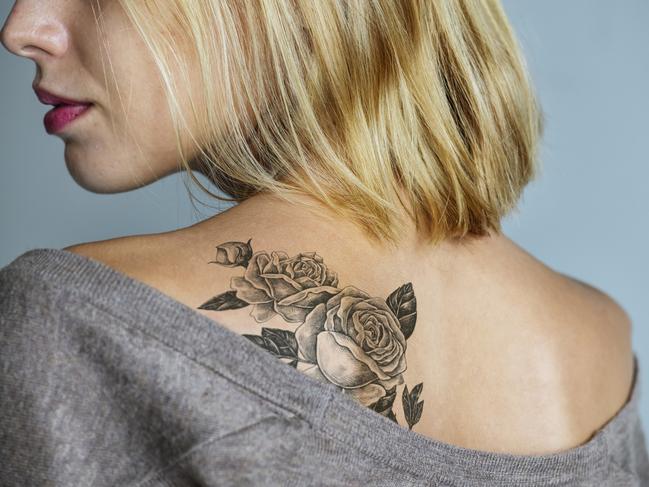 Back tattoo of a woman***These are our own 3D generic designs. They do not infringe on any copyrighted designs.***picture istock