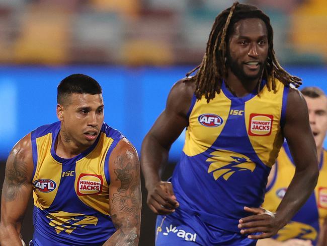 AFL Round 15. West Coast Eagles vs Essendon at the Gabba, Brisbane. 01/09/2020... Tim Kelly of the Eagles clears out of the middle after a handball from Nic Naitanui   . Pic: Michael Klein