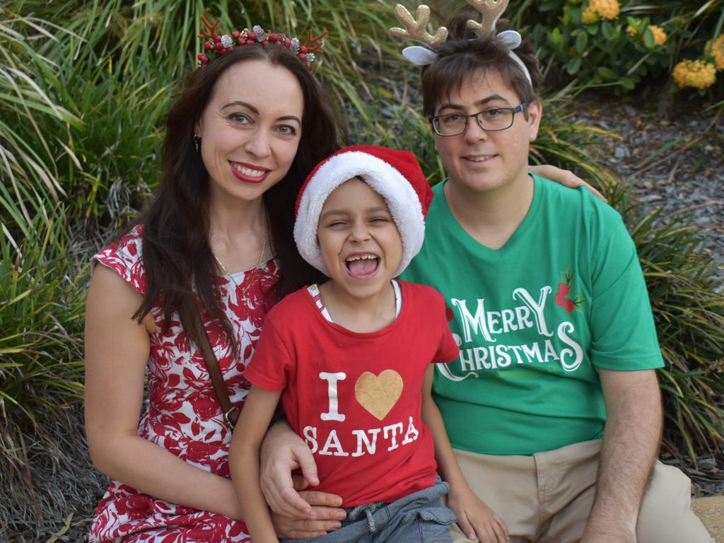 Svetlana Krasnova, Matthew Cozier and Christopher Qasim at the CBD Christmas Fair in Rockhampton on December 3, 2022.