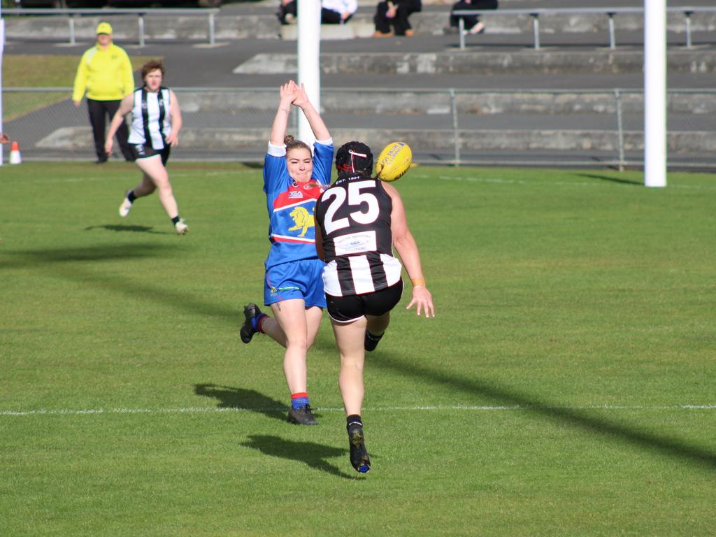 Claremont's Natalie Curtis gets a kick away in the match up against Huonville in the SFLW Community League. Picture: Jake Garland