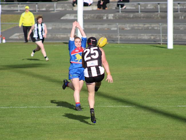Claremont's Natalie Curtis gets a kick away in the match up against Huonville in the SFLW Community League. Picture: Jake Garland