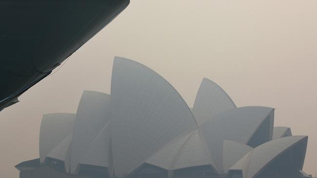 The Opera House is shrouded in think smoke. Picture: Toby Zerna