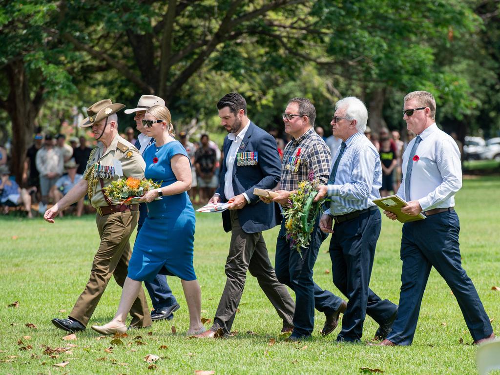 L-R Scott Bailey, Nicole Manison, Brent Potter, Luke Gosling, Kon Vatskalis and Paul Kirby paid tribute at the Darwin Cenotaph with the laying of wreaths, 2023. Picture: Pema Tamang Pakhrin