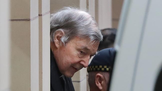 George Pell loses his appeal in the Supreme Court of Melbourne, and is led away in a prison van. Picture: Alex Coppel