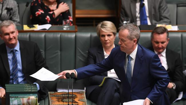 Bill Shorten tables the renunciation of his British citizenship in parliament yesterday, declaring the citizenship ‘circus has to stop’. Picture: AAP