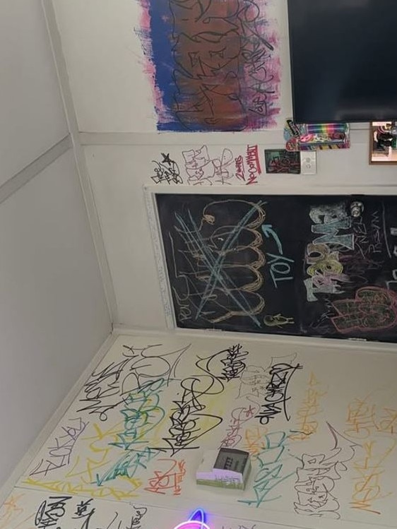 The second photo showed graffiti tags inside what appears to be the inside of her home. Picture: Instagram