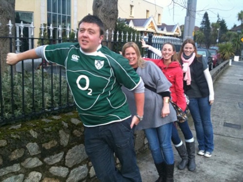 The group lean is a traditional community activity among some British tribes. Either that or this man is being mocked by a group of women. Who knows?