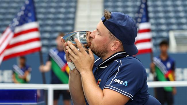 Dylan Alcott of Australia celebrates with the championship trophy