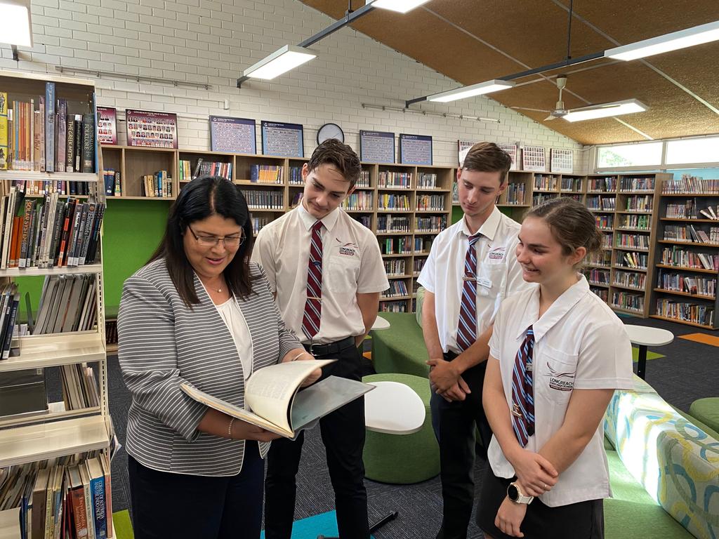 Education Minister Grace Grace with Longreach State High School students Hugo, Seth and Aiyahna.