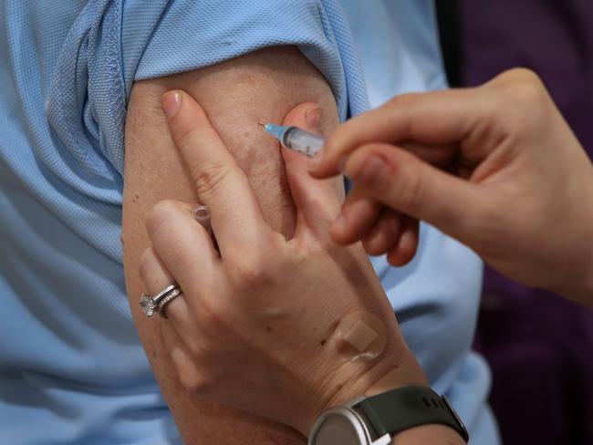 SYDNEY, AUSTRALIA - MARCH 23: Nurse Emma McCallum administers the COVID-19 AstraZeneca vaccine to Pamela Rawson  at the Sydney Road Family Medical Practice on March 23, 2021 in Sydney, Australia. Medical practices across Australia have started COVID-19 vaccinations for eligible Australians under the Phase 1b rollout. (Photo by Lisa Maree Williams/Getty Images)