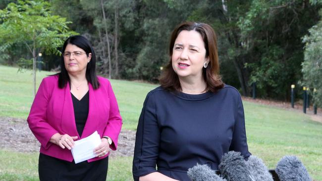 Premier Annastacia Palaszczuk (front) faces the media with Education Minister Grace Grace. Picture: Richard Gosling/AAP