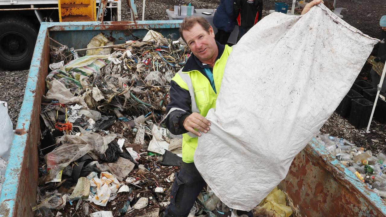 Ian Thomson from Ocean Crusaders with some of the rubbish collected during a clean-up of Moonee Creek. Picture: David Crosling