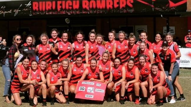 Anne-Marie Geary (holding sign) played her 50th game for the Burleigh Bombettes this month. Pic: Supplied.