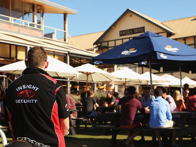 A security guard watches over the 2012 New Year's Eve celebrations at the Portsea Hotel. Picture: Hamish Blair