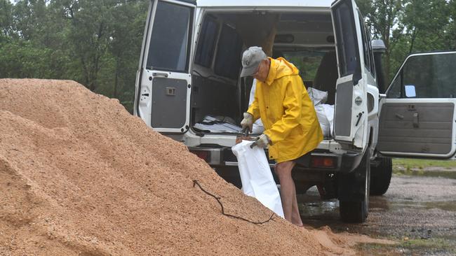 Tuesday February 4. Heavy rain causes flooding in North Queensland. Jimmy Huan gets sandbags at the Bluewater Recreational Centre. Picture: Evan Morgan