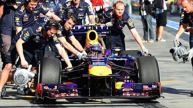 Mark Webber gets a hand out of pit lane