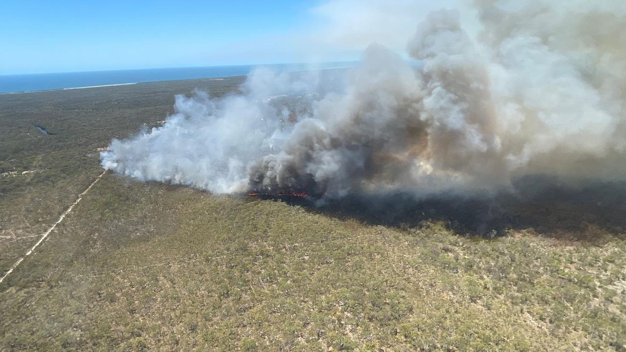 QFES aircrews captured this photos of a bushfire burning at Deepwater on Sunday where several properties were evacuated and some roads closed.