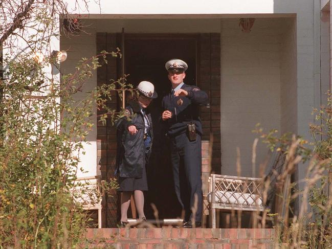 Tasmanian police outside the home of Martin Bryant.