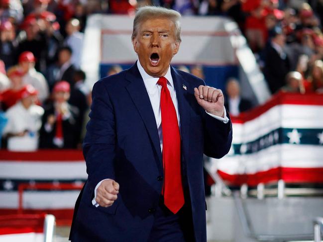 RALEIGH, NORTH CAROLINA - NOVEMBER 04: Republican presidential nominee, former President Donald Trump dances off stage at the conclusion of a campaign rally at the J.S. Dorton Arena on November 04, 2024 in Raleigh, North Carolina. With one day left before the general election, Trump is campaigning for re-election in the battleground states of North Carolina, Pennsylvania and Michigan.   Chip Somodevilla/Getty Images/AFP (Photo by CHIP SOMODEVILLA / GETTY IMAGES NORTH AMERICA / Getty Images via AFP)