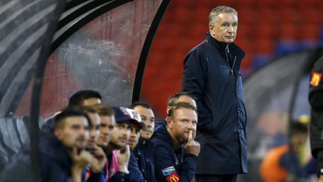 Newcastle coach Ernie Merrick watches from the dugout as the Jets went down to the Mariners on Saturday. Picture: AAP