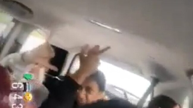 Masked youths flipping the bird inside the alleged stolen Honda CRV on Saturday. Picture: Supplied