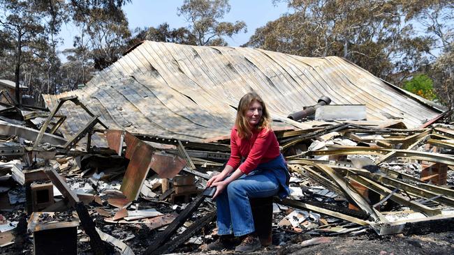 Dargan resident Fiona Farquhar sits among the ruins of her home in Dargan. Picture: Sam Mooy