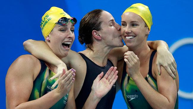 Brittany Elmslie, Bronte Campbell and Emma McKeon of Australia celebrate winning gold and a new world record in the final of the Women's 4 x 100m freestyle relay at the Rio 2016 Olympic Games. Picture: Getty