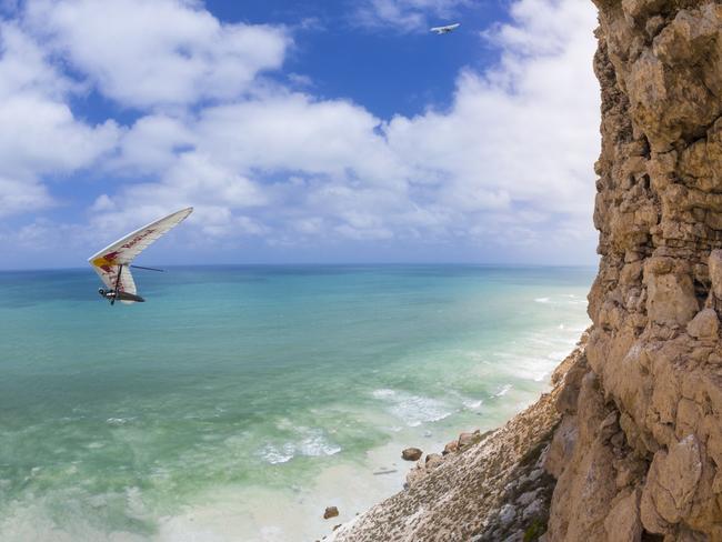 Hangglider Jon Durand rides the Nullarbor updrafts along the coastline of the Great Australian Bight at Eucla. Picture: Mark Watson